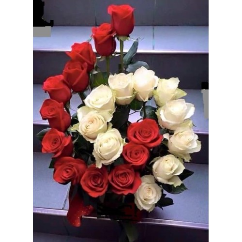 Floral arrangement of red and white roses in a spiral